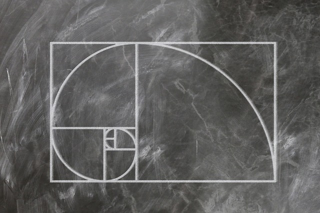 The golden spiral drawn on a black chalkboard.