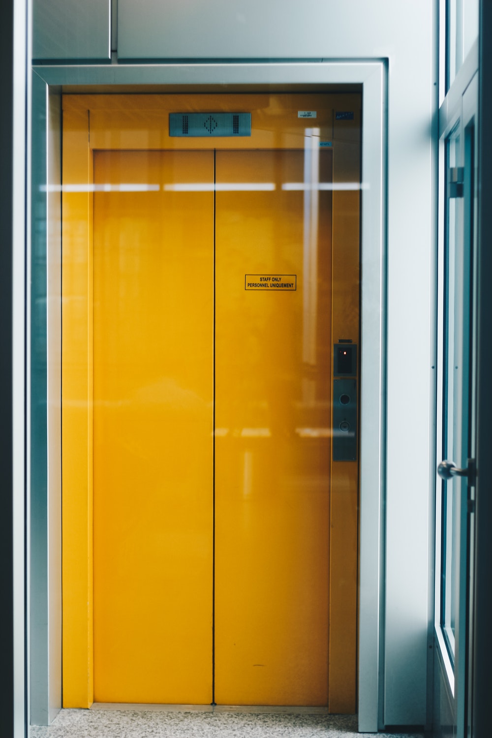 closed yellow elevator doors