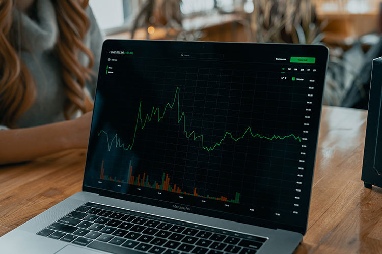Laptop computer with a line graph on the screen