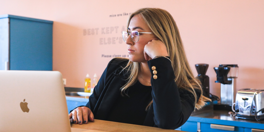 woman wearing glasses at computer