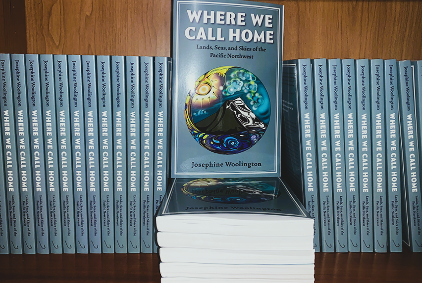 stack of WHERE WE CALL HOME books on shelf