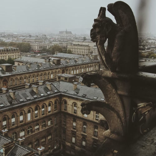 Gargoyle overlooking city of Paris