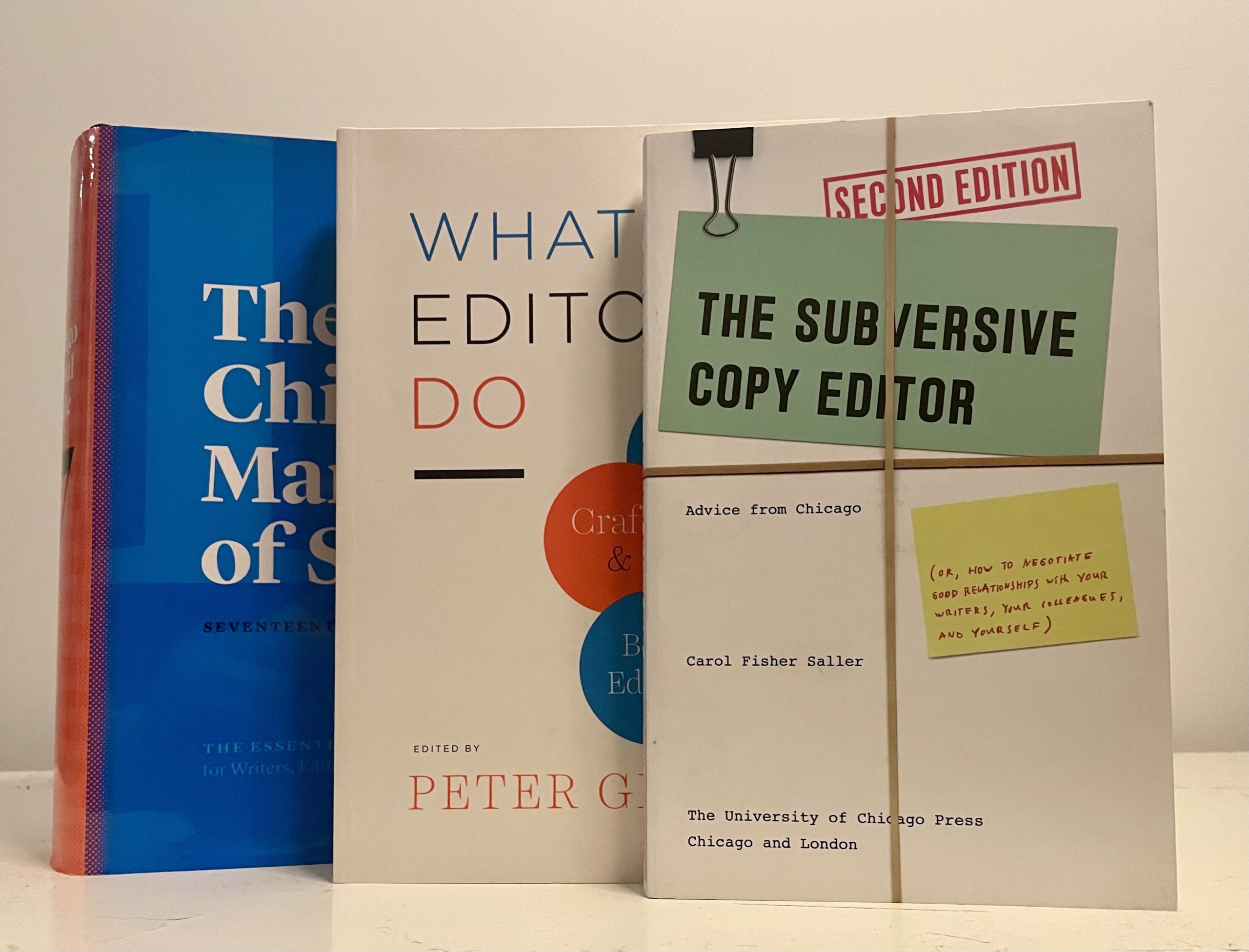 A stack of books titled What Editors Do, The Subversive Copy Editor, and Chicago Manual of Style