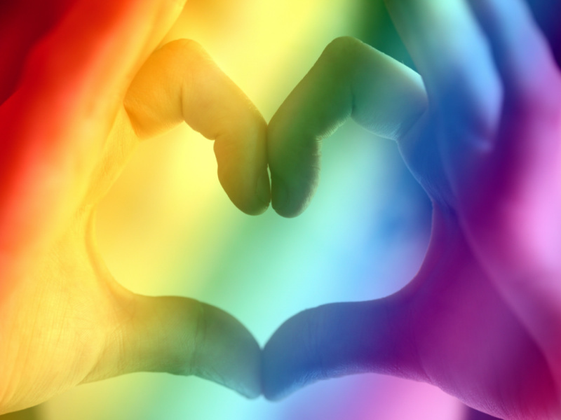 hands-forming-a-heart-with-rainbow-colors-overlay