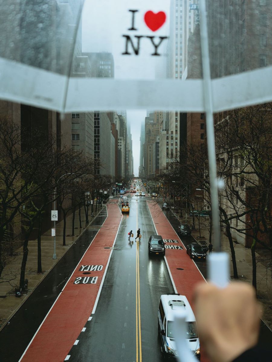 I heart New York umbrella over rainy city street