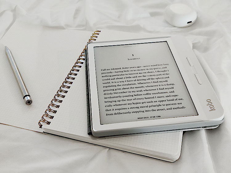 Kindle on an open notebook.